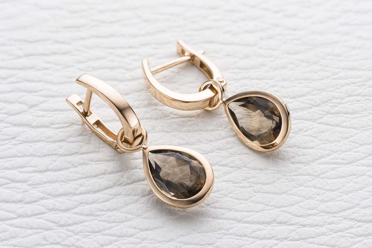 Серьги-трансформеры из красного золота с 2 раухтопазами