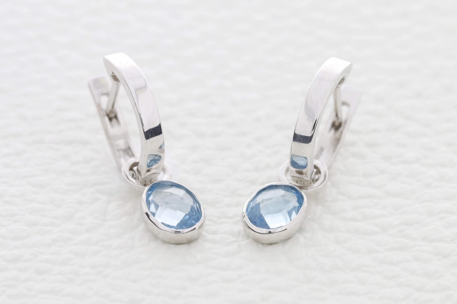 Серьги-трансформеры из белого золота с 2 топазами sky