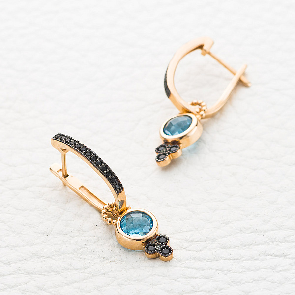 Серьги-трансформеры из красного золота с 2 топазами swiss и 32 фианитами