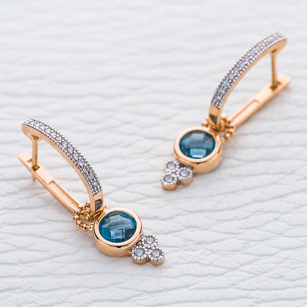 Серьги-трансформеры из красного золота с 2 топазами swiss и 32 фианитами