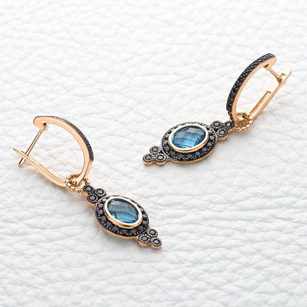 Серьги-трансформеры из красного золота с 2 топазами swiss и 70 фианитами