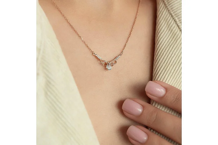 Колье Бантик из красного золота с топазом sky и 6 фианитами