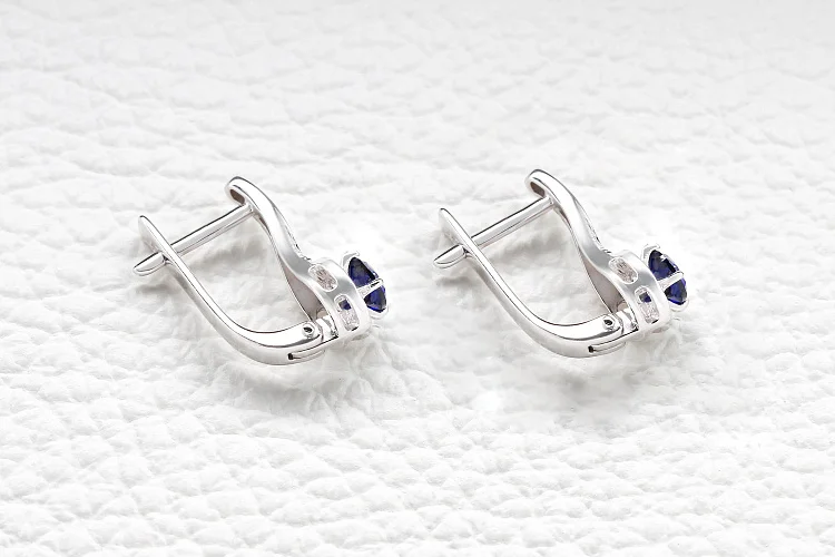 Серьги из белого золота с 2 корундами и 36 бриллиантами