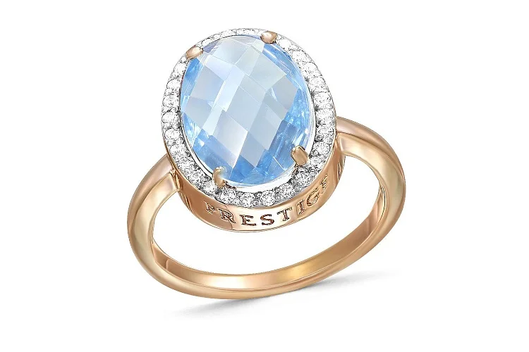 Кольцо из красного золота с топазом sky и 28 фианитами