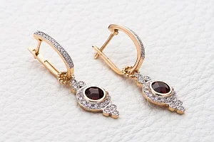 Серьги-трансформеры из красного золота с 2 гранатами и 66 фианитами