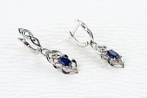 Серьги из белого золота с 2 корундами и 16 бриллиантами