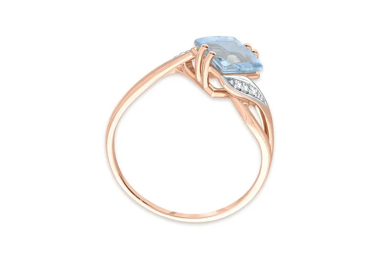 Кольцо из красного золота с топазом sky и 6 фианитами