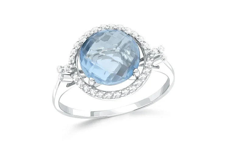 Кольцо из белого золота с топазом sky и 32 фианитами