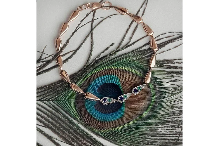 Браслет из красного золота с корундами, фианитами и изумрудами