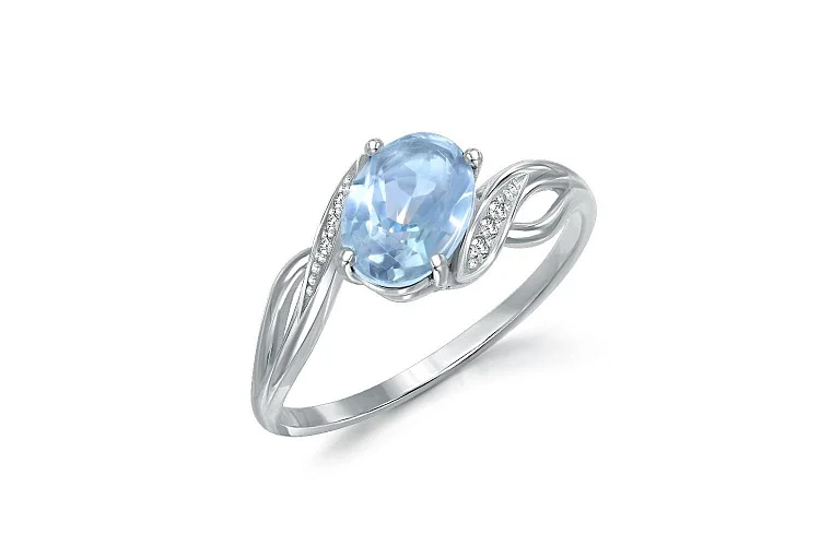Кольцо из белого золота с топазом sky и 6 фианитами