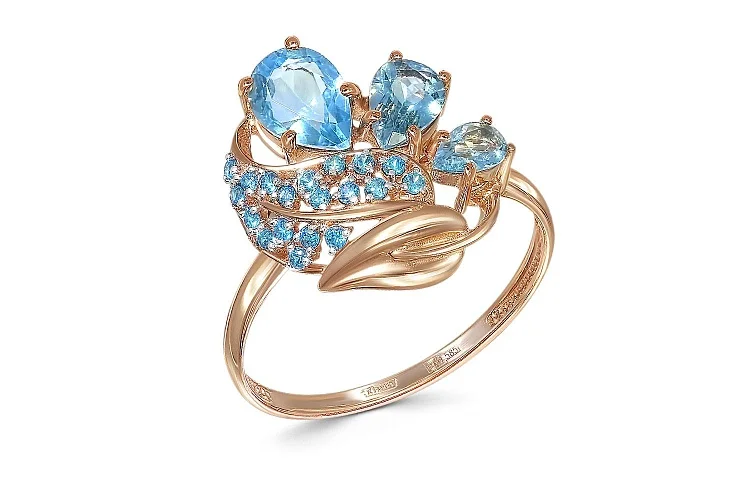 Кольцо из красного золота с 3 топазами swiss и 19 фианитами
