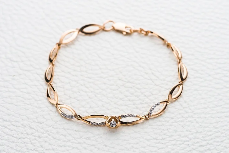 Браслет из красного золота с 21 фианитами