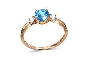 Кольцо из красного золота с топазом swiss и 2 фианитами