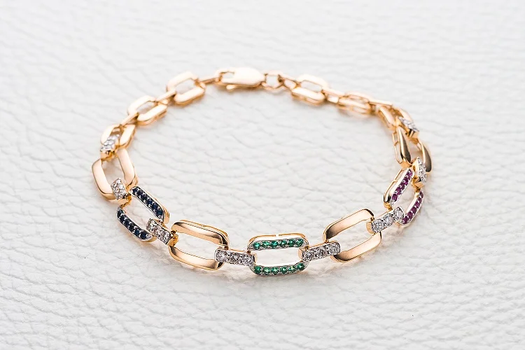 Браслет из красного золота с бриллиантами, изумрудами и сапфирами