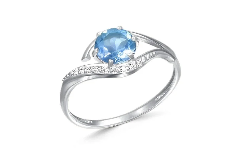 Кольцо из белого золота с топазом sky и 9 фианитами