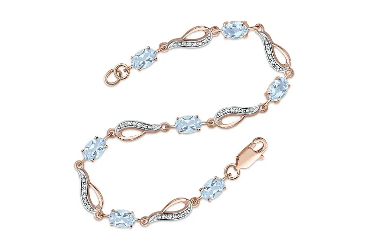 Браслет Дорожка из красного золота с 7 топазами sky и 35 фианитами