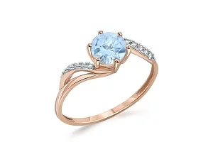 Кольцо из красного золота с топазом sky и 10 фианитами