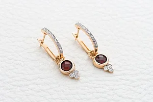 Серьги-трансформеры из красного золота с 2 гранатами и 32 фианитами