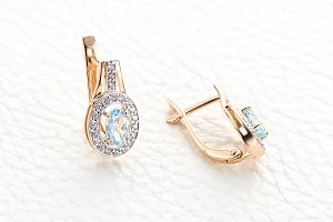 Серьги из красного золота с 2 топазами sky и 42 фианитами