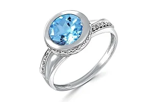Кольцо из белого золота с топазом swiss и 36 фианитами