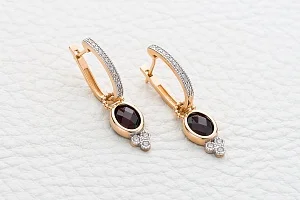 Серьги-трансформеры из красного золота с 2 гранатами и 32 фианитами