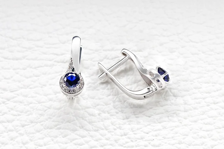 Серьги из белого золота с 2 корундами и 36 бриллиантами